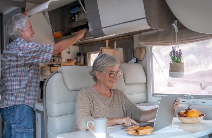 Grey nomads planning their day over breakfast while caravanning Queensland