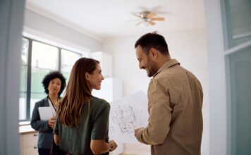 Couple receiving property advice, open home, Australian home