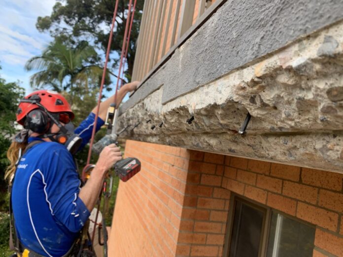 ADFXGRA Feb26 QPE concrete cancer - GRA image Concrete cancer repairs to high rise balcony. Image by Gecko Rope Access.